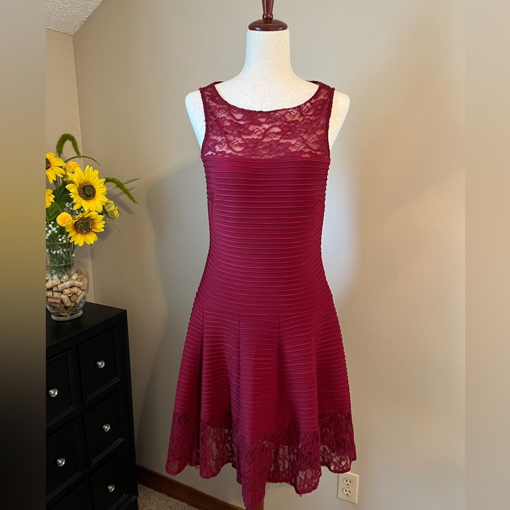 Dropped waist, cherry red cocktail dress with lace detail on the bodice & hem.